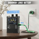 Load image into Gallery viewer, Electronic device with 5000mAh label on a wooden table, plugged into a wall outlet.