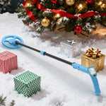 Load image into Gallery viewer, Blue metal detector on snow with Christmas tree and presents in the background