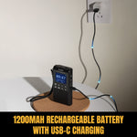 Load image into Gallery viewer, Black portable device with Raddy RD939 digital display on a cork coaster, plugged into a wall socket with text '1200mAh rechargeable battery with USB-C charging'.