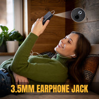 Woman lying on a couch using a Raddy RD939 with a 3.5mm earphone jack.