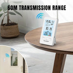 Load image into Gallery viewer, Raddy V4 Wireless Weather Station thermometer on a table with &#39;60M Transmission Range&#39; text and a small inset showing a door with a remote control.
