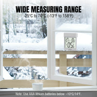 Raddy WT-1 Digital Window Thermometer on a window sill with a snowy outdoor view